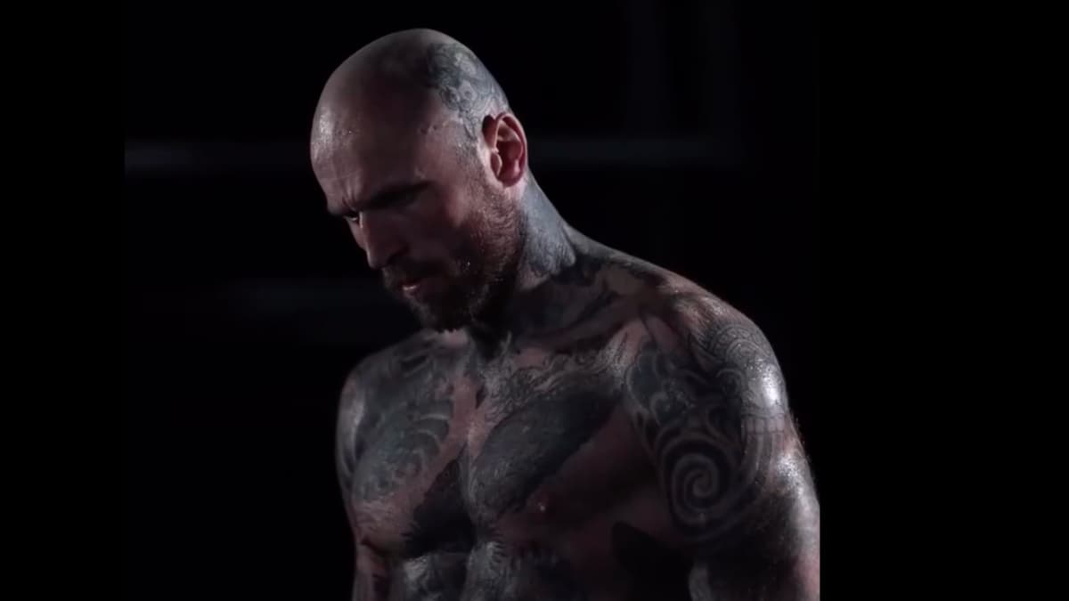 Aleister Black with a bald head