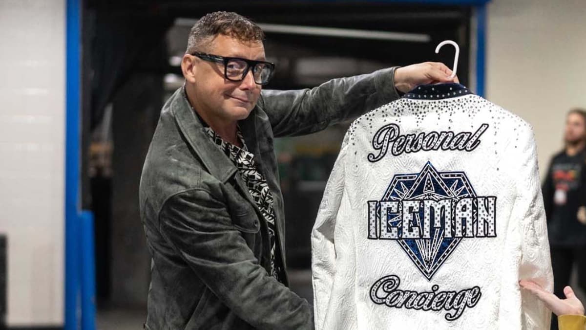 George Iceman holding up a Personal Concierge jacket