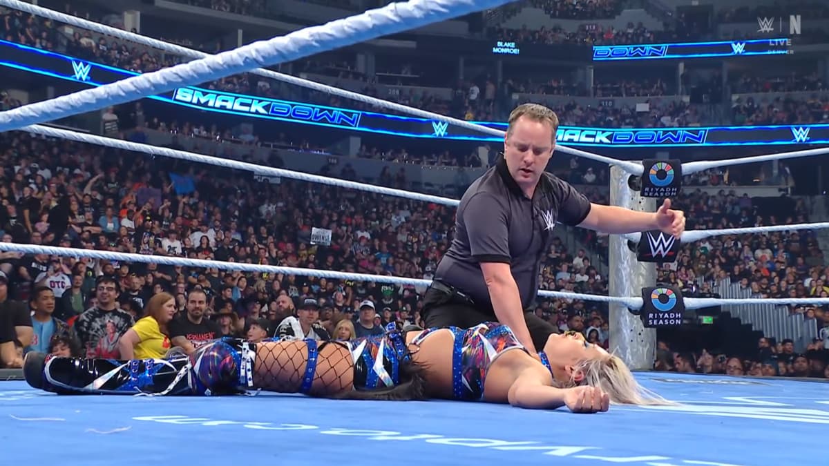 Giulia being checked on by WWE SmackDown referee