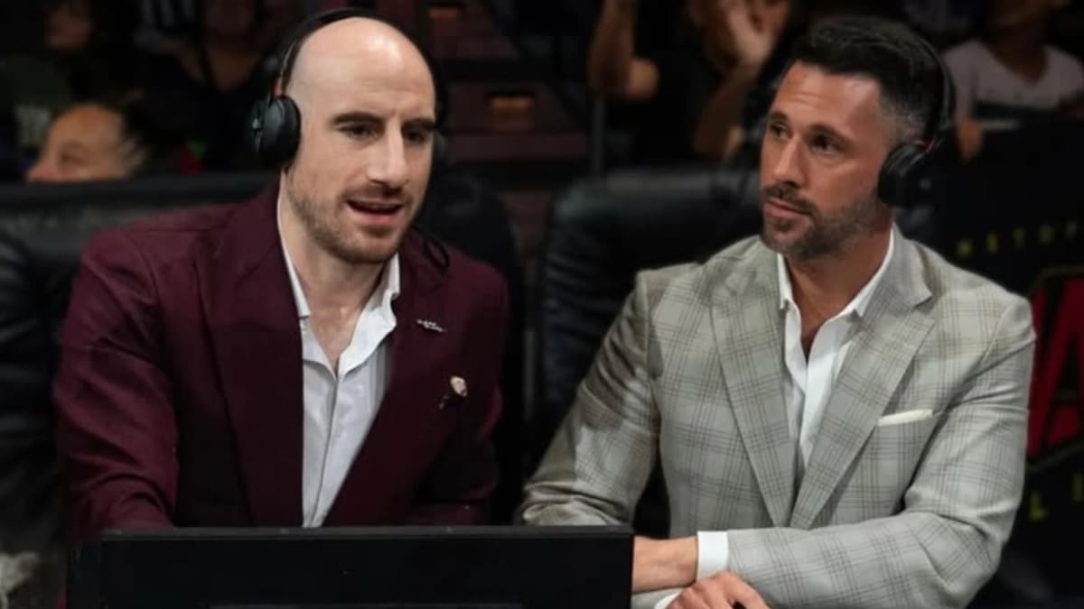 Matthew Rehwoldt and Tom Hannifan in headsets sat behind a desk