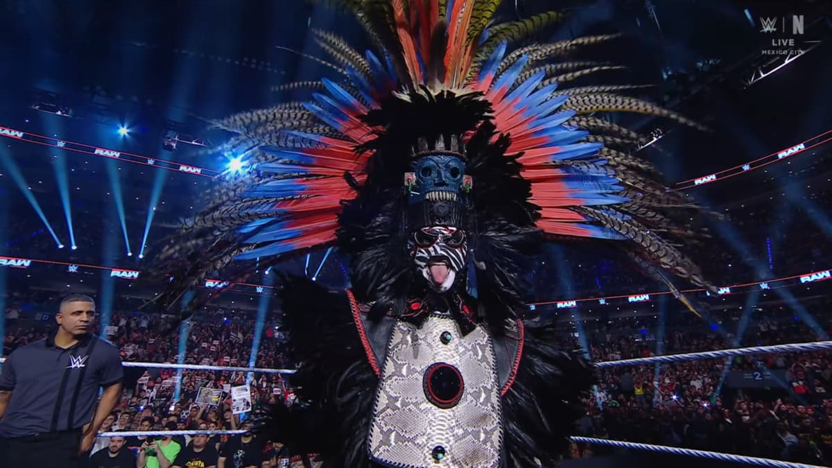 Penta with a massive headpiece on sticking his tongue out