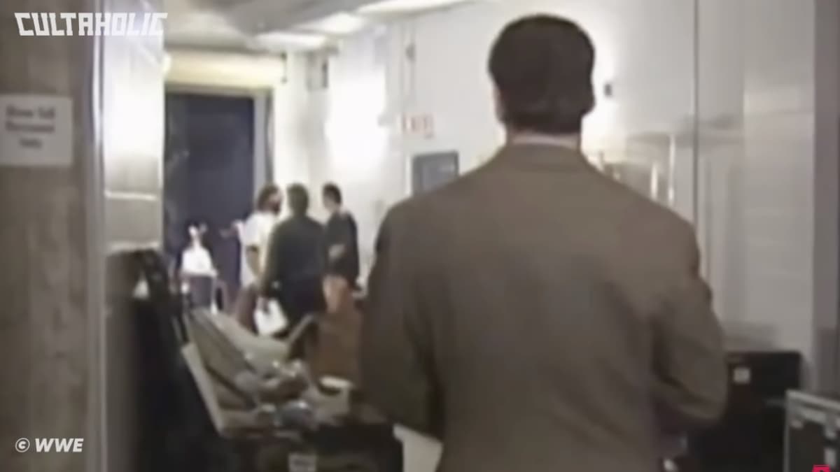 The Rock and Mankind chatting to each other at WWE Rock Bottom 1998