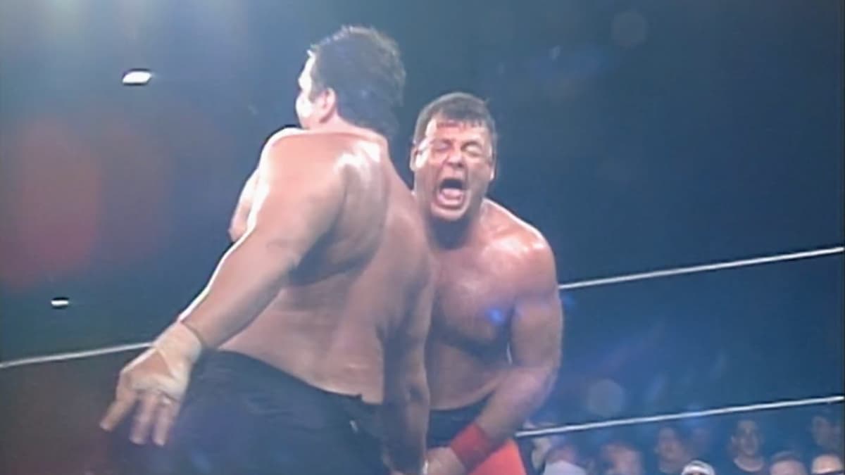 Tommy Dreamer grabbing Jerry Lawler's testicles, who is shrieking in pain