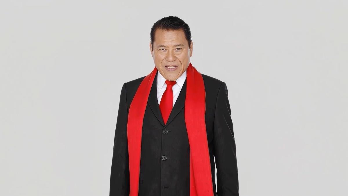 AI version of Antonio Inoki looking stoic in a black suit and red scarf