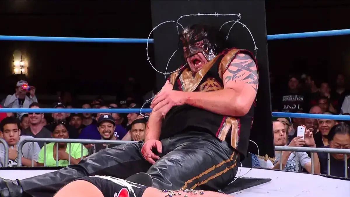 Abyss lying on a barbed wire table in TNA Monster's Ball Match