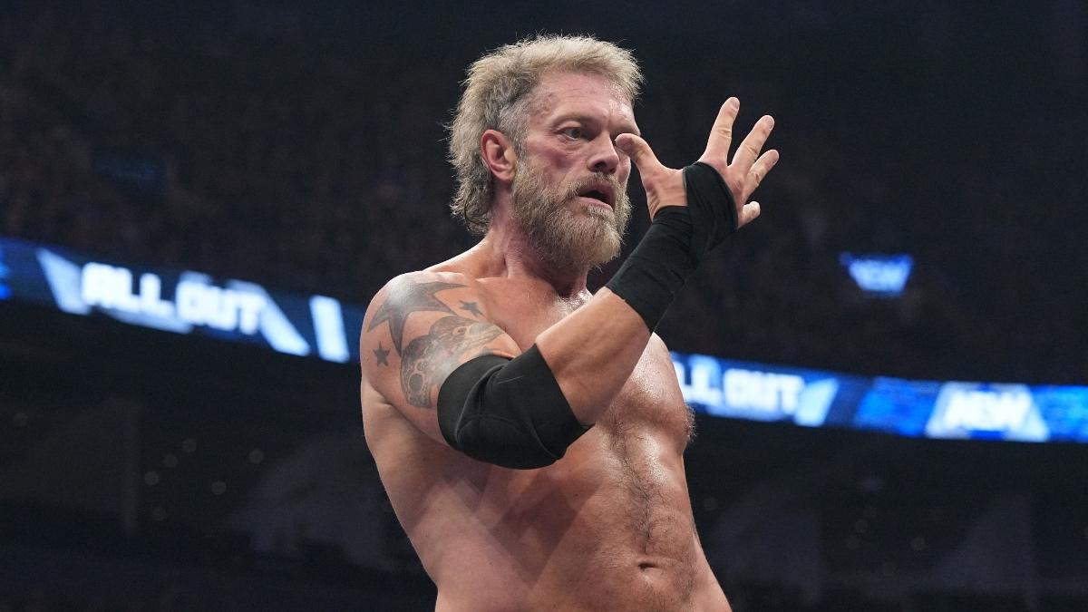 Adam Copeland performing John Cena's "You Can't See Me" pose with his right hand 