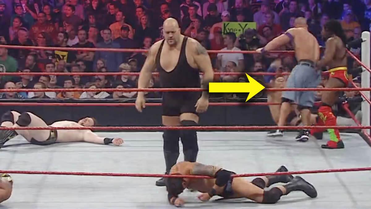 Royal Rumble 2011 ring with a yellow arrow pointing to Alex Riley falling out of the ring