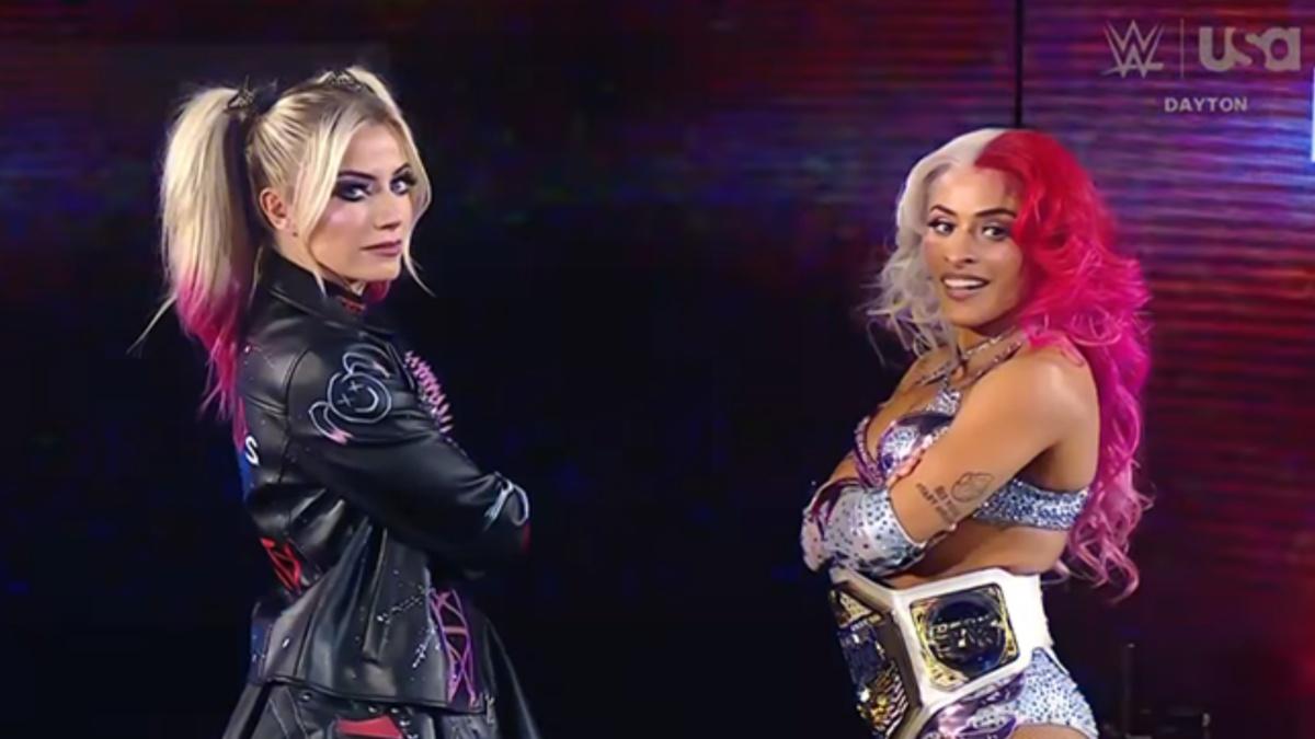 Alexa Bliss standing with Zelina Vega