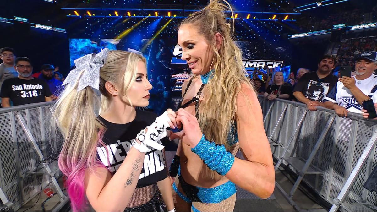 Alexa Bliss and Charlotte Flair forming a half with their hands on WWE SmackDown