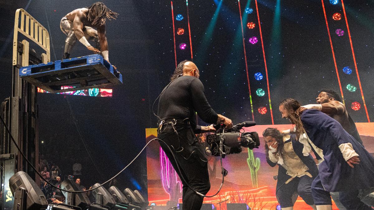 Swerve Strickland on a forklift while Powerhouse Hobbs holds The Young Bucks at AEW Double or Nothing 2025