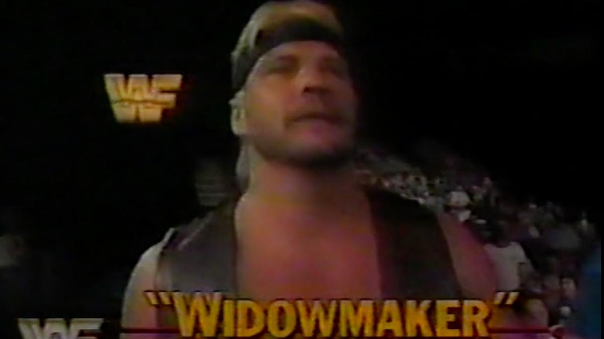 "Widowmaker" Barry Windham with bleach blonde hair wearing a head band and leather vest