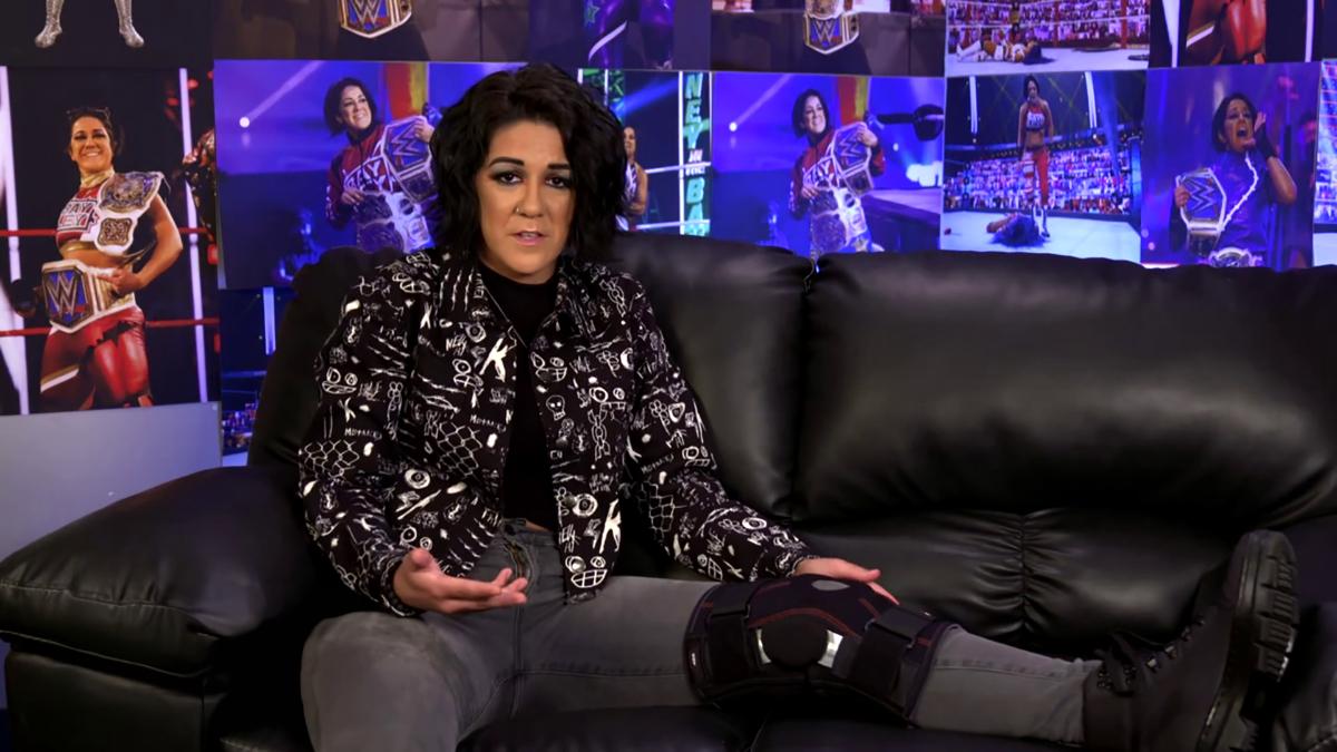 Bayley with her knee in a brace