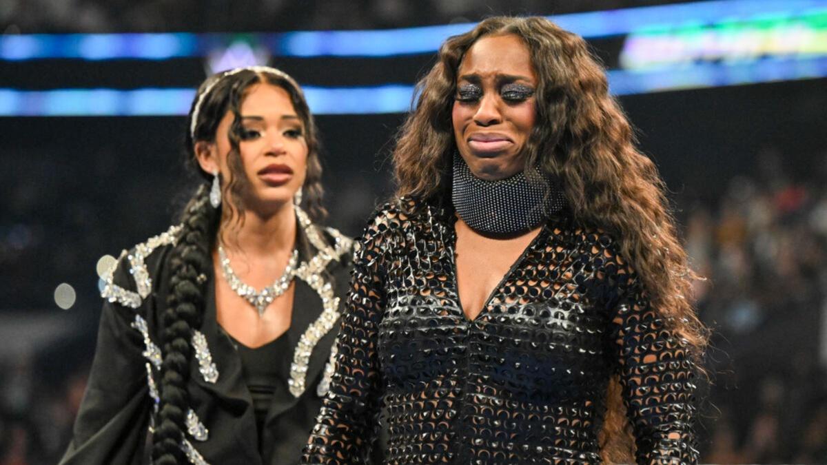 Naomi crying next to Bianca Belair 