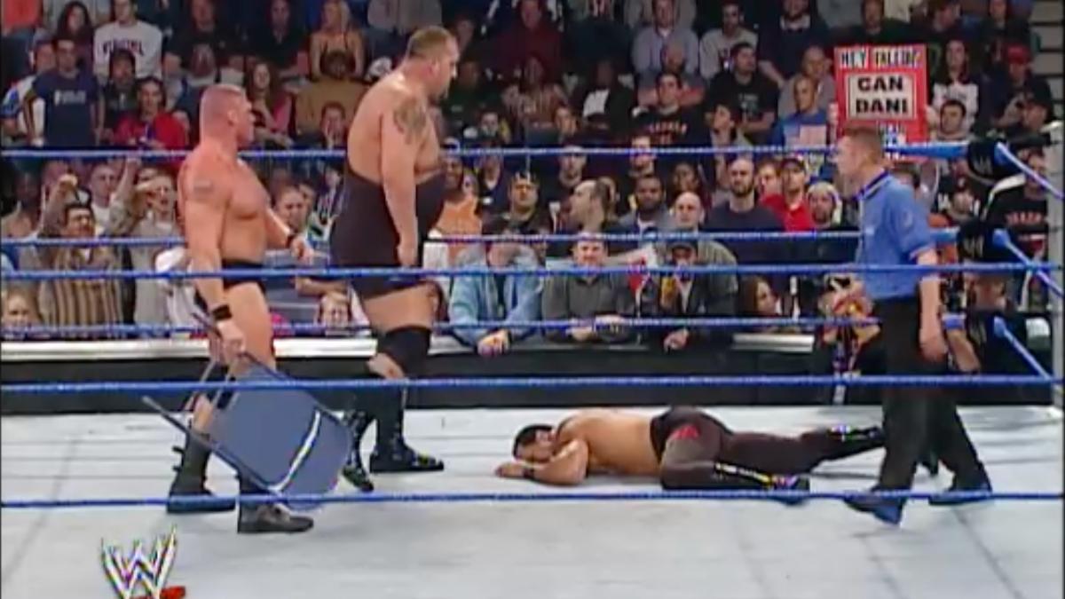 Faaroq lay on the ground with Big Show standing over him and Brock Lesnar with a steel chair