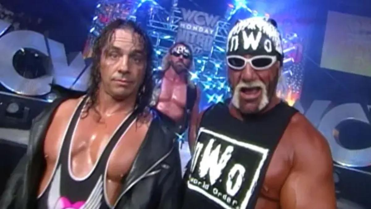 Bret Hart and Hulk Hogan in NWO gear walk down the WCW Nitro ramp. The Disciple is in the background.