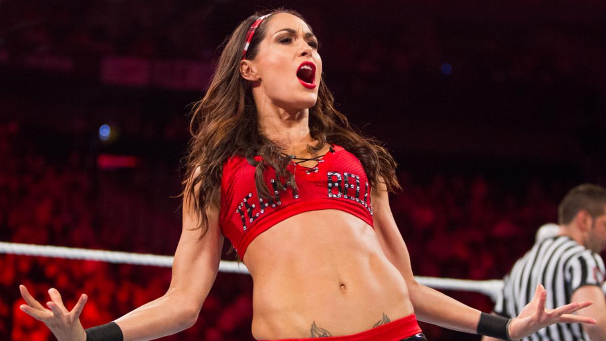 Brie Bella posing and yelling in a WWE ring.