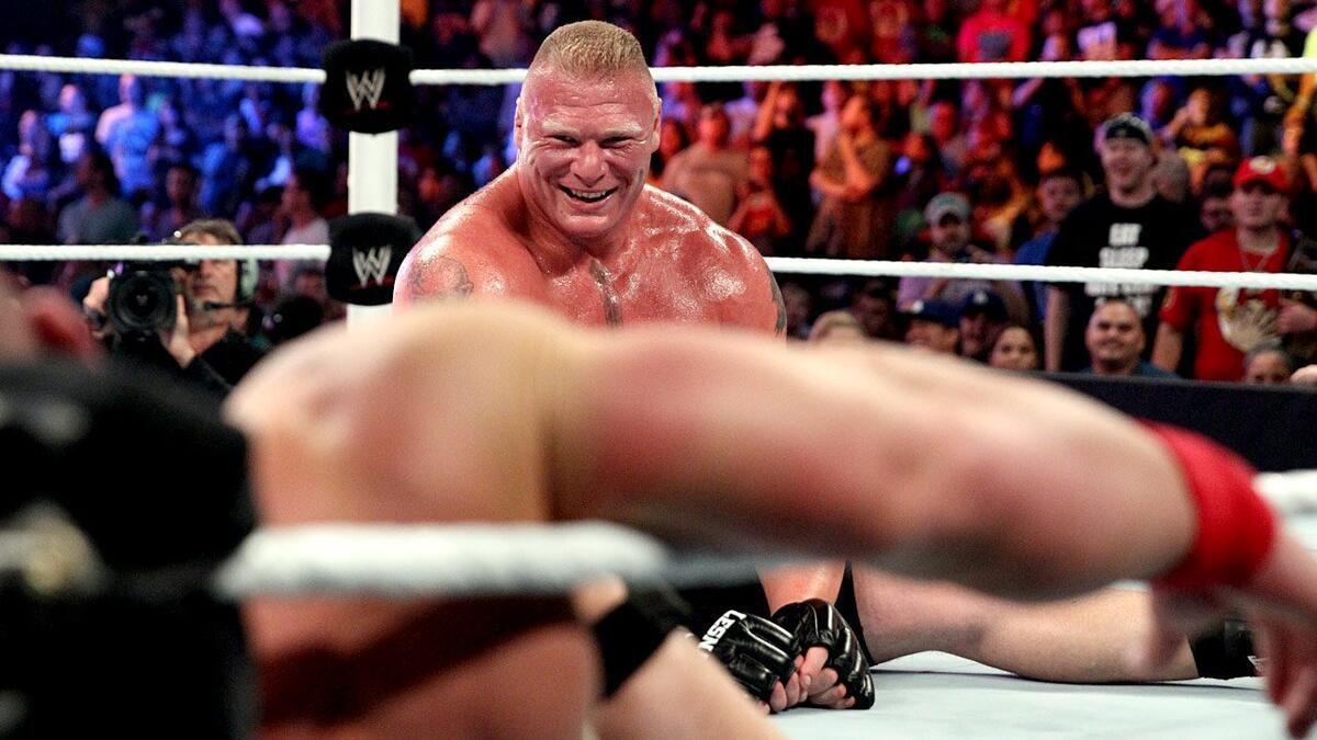 Brock Lesnar laughing as John Cena is stuck in the corner
