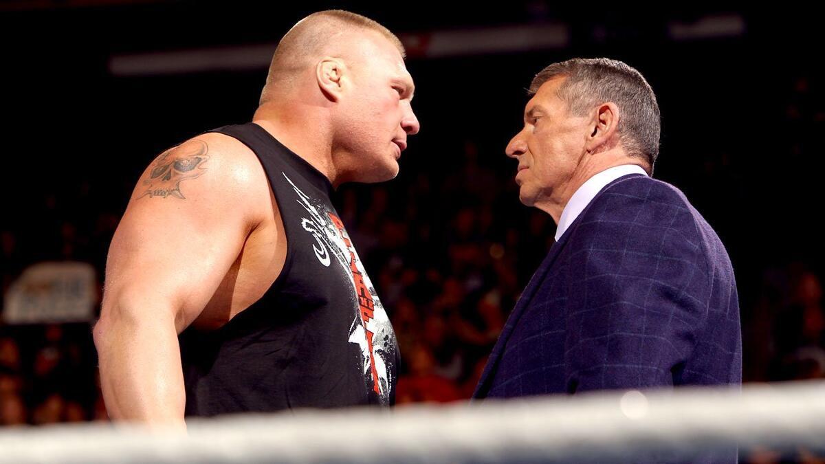 Brock Lesnar and Vince McMahon staring at each other on WWE Raw