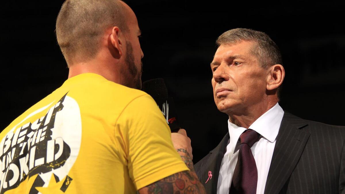 Vince McMahon stares at CM Punk during an in-ring promo segment on WWE Raw in 2012