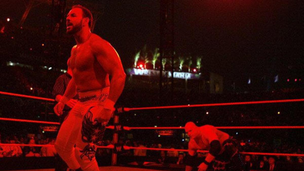 Kane sneaking up behind Chavo Guerrero at WWE WrestleMania XXIV