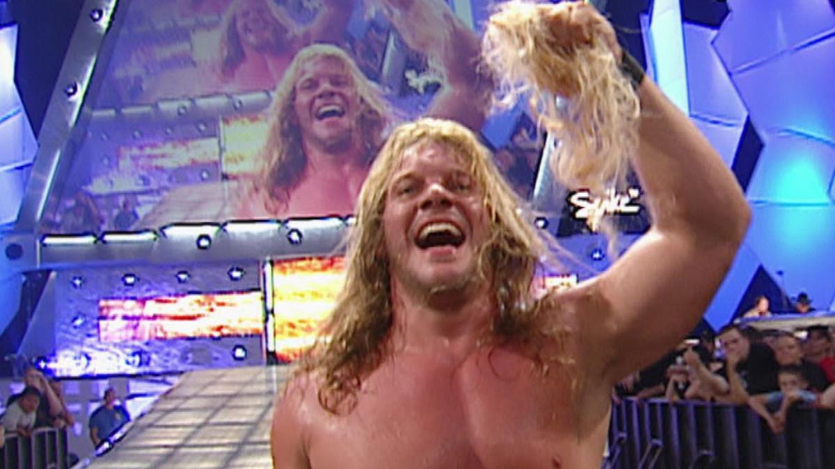 Chris Jericho with a handful of Kevin Nash's hair in 2003