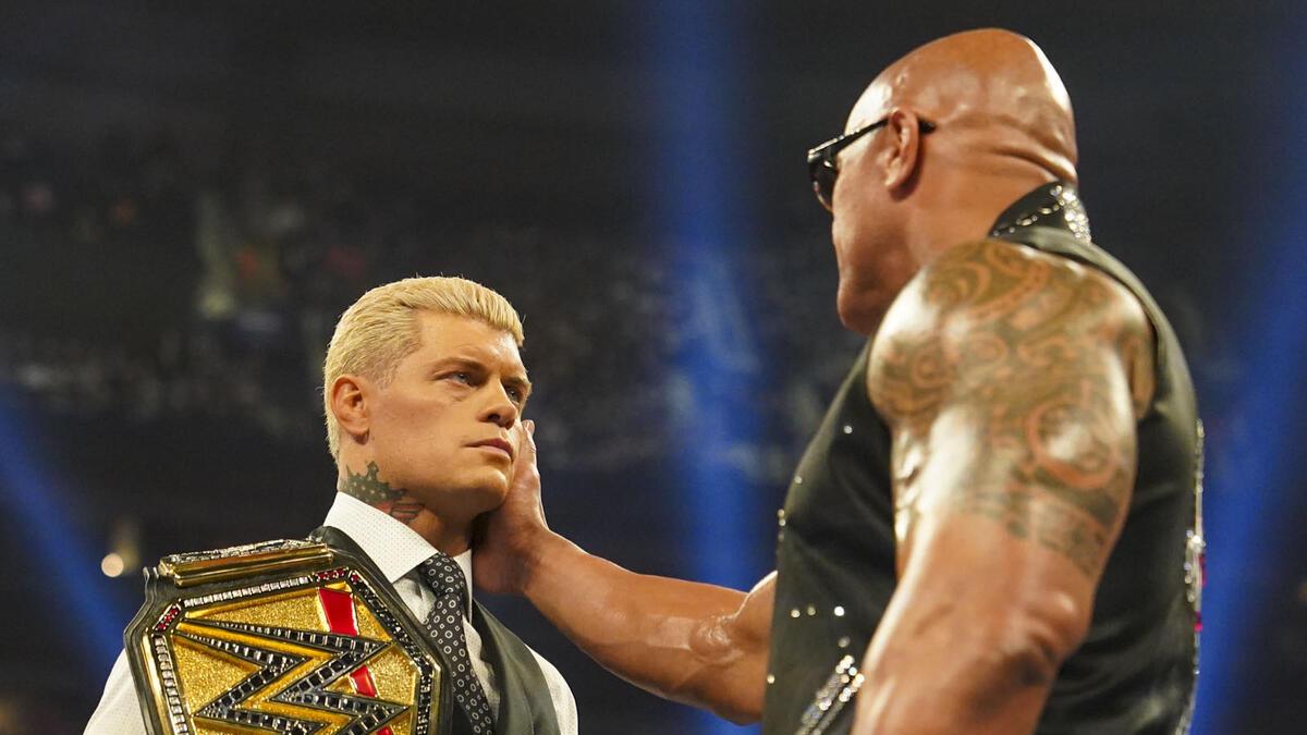 Cody Rhodes having his face touched by The Rock at WWE Elimination Chamber 2025