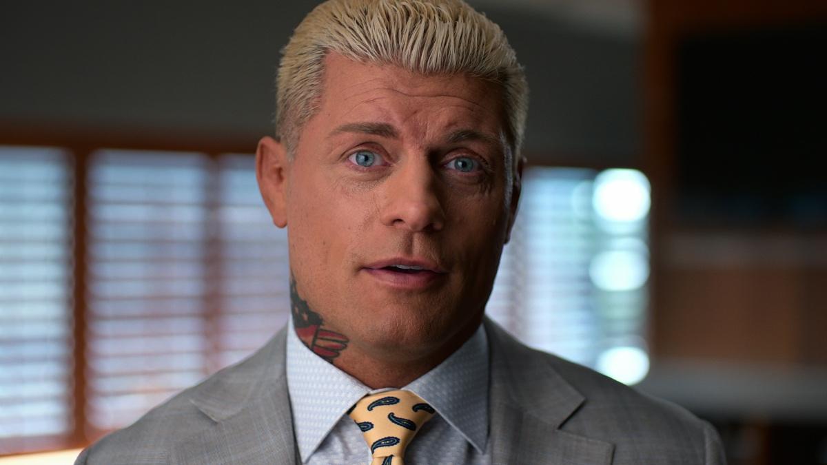 Cody Rhodes in a grey suit at WWE: Unreal