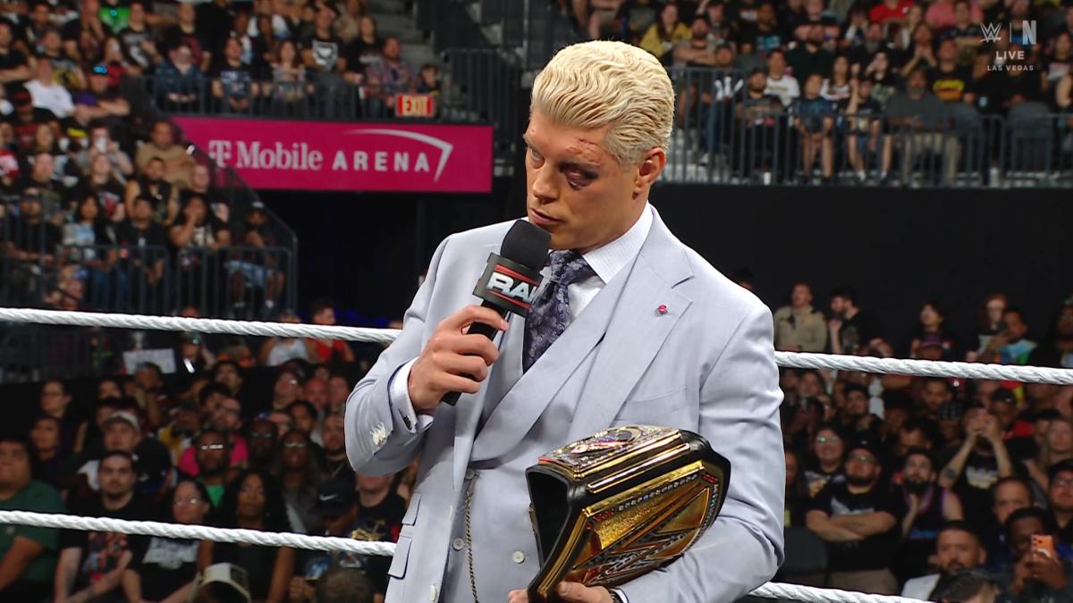 Cody Rhodes wearing a grey suit with a black eye on WWE Raw