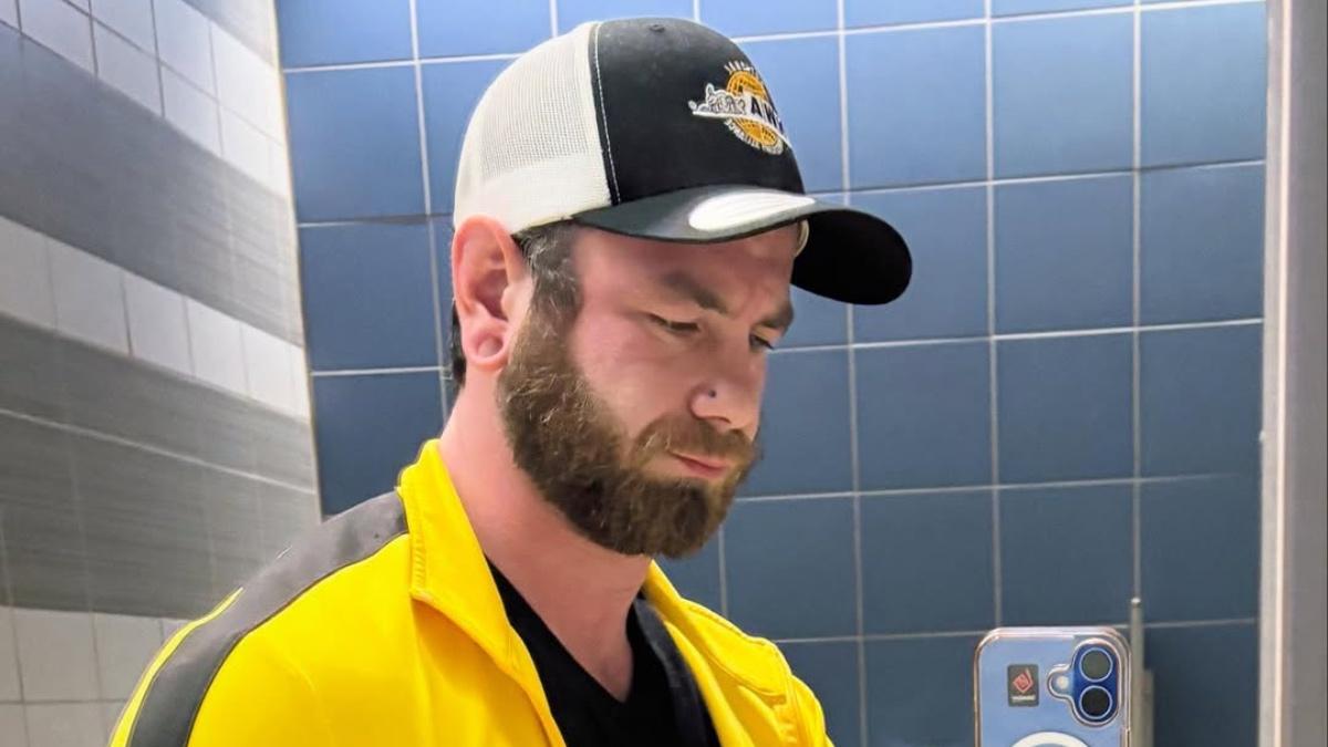 Colby Corino wearing an NWA hat while taking a selfie