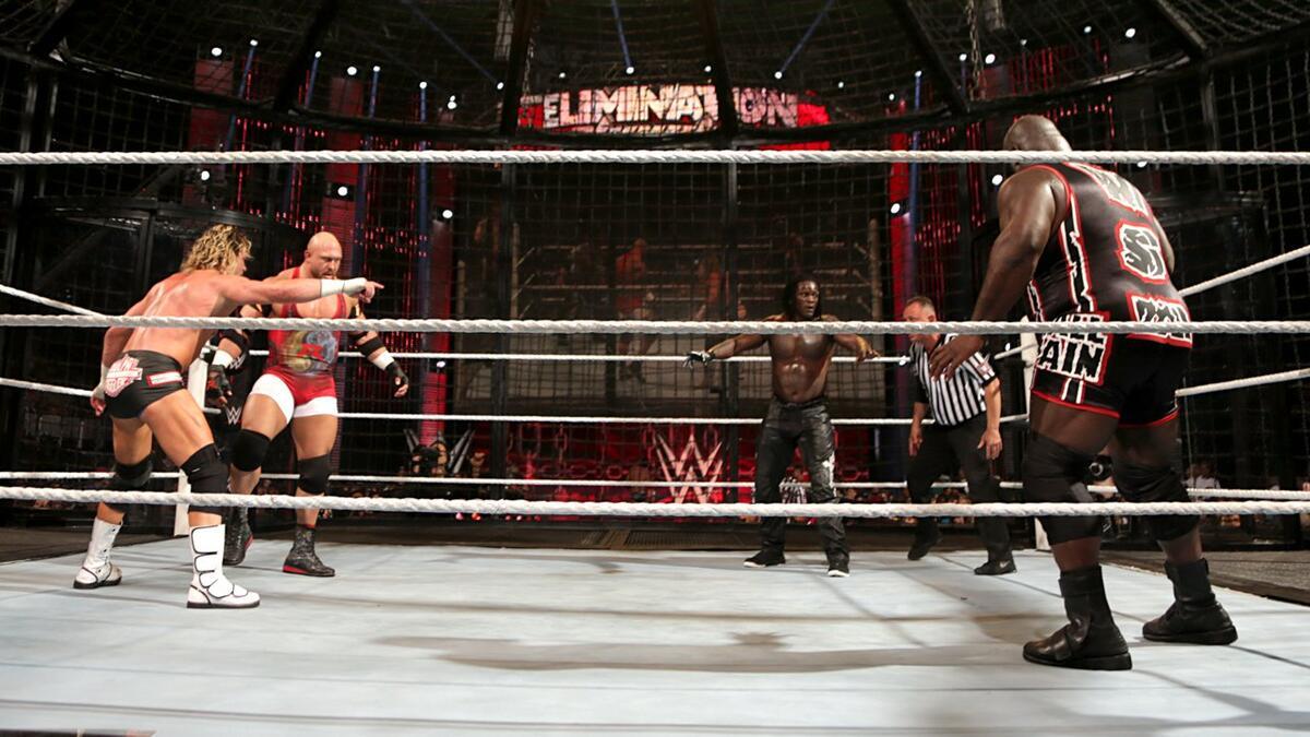 Dolph Ziggler pointing as he, Ryback, R-Truth and Mark Henry each stand in a corner at WWE Elimination Chamber 2015