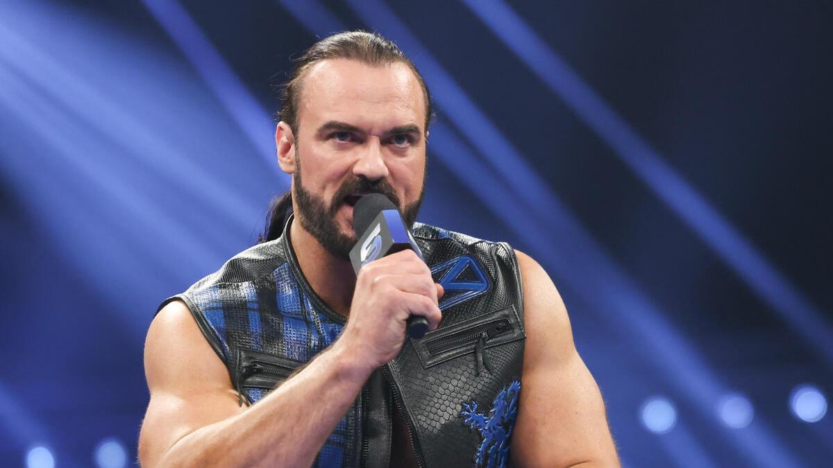 WWE star Drew McIntyre holds the microphone while cutting a promo on an episode of SmackDown in March 2025