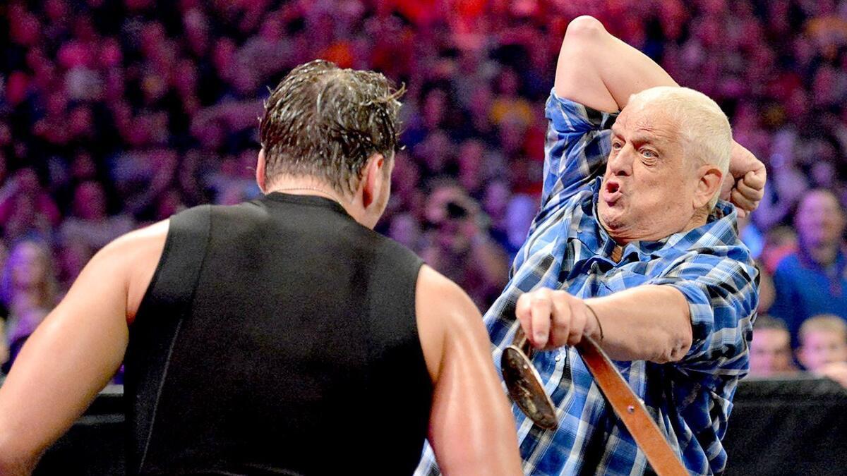 Dusty Rhodes hitting Dean Ambrose with a Bionic Elbow at WWE Battleground 2013