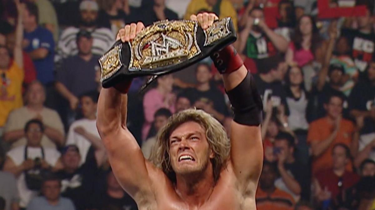 Edge holding up the WWE Title