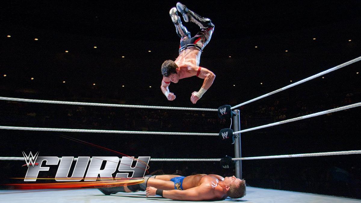 Evan Bourne hitting a shooting star press to Ted DiBiase Jr.