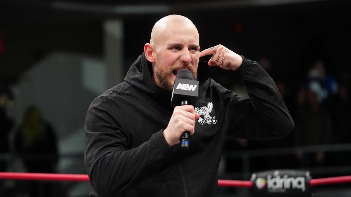 Gabe Kidd cutting a promo on AEW Collision while wearing a black hoodie