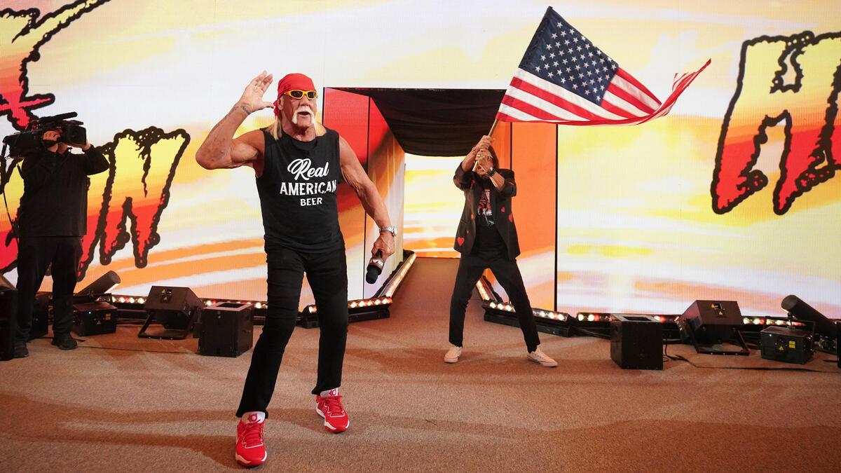 Hulk Hogan on WWE Raw with Jimmy Hart waving a US flag in the background 