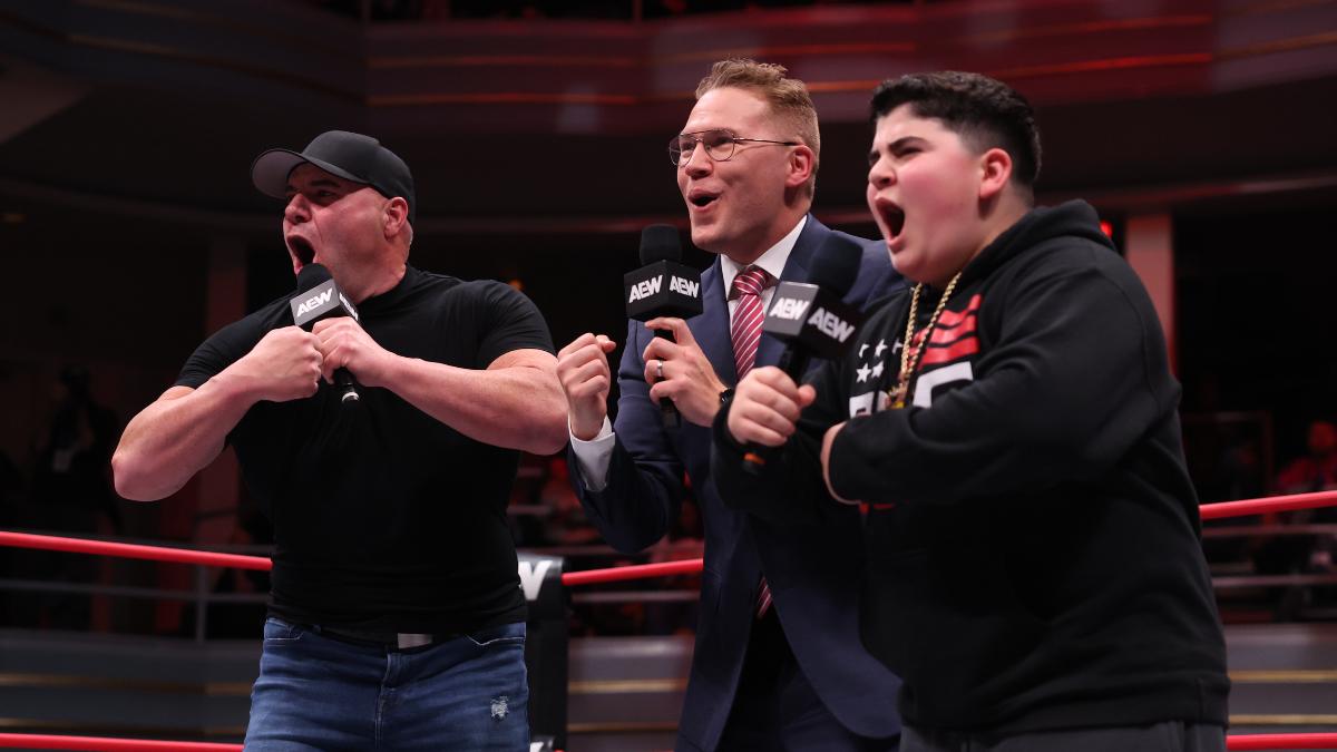 Ian Riccaboni, Big Boom AJ, and Big Justice all shouting BOOM into a microphone inside the ring at Hammerstein Ballroom,