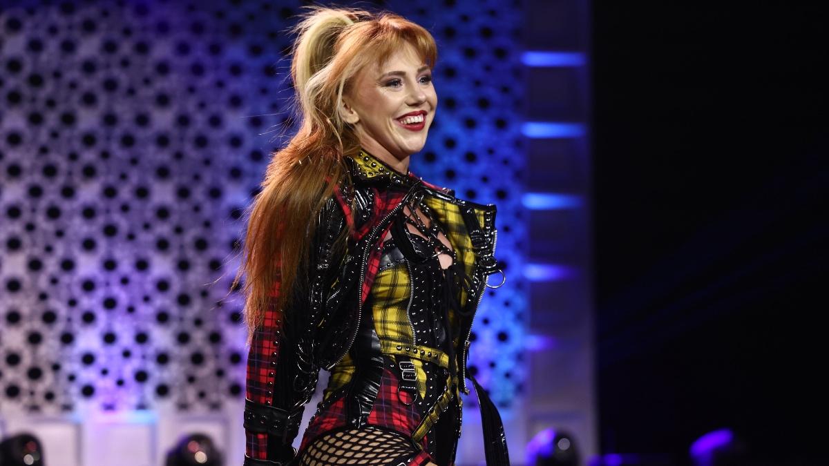 Isla Dawn wearing a yellow and red tartan jacket