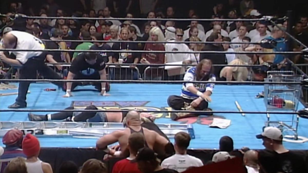 Jake Roberts and Tommy Dreamer looking sad at ECW November to Remember 1998