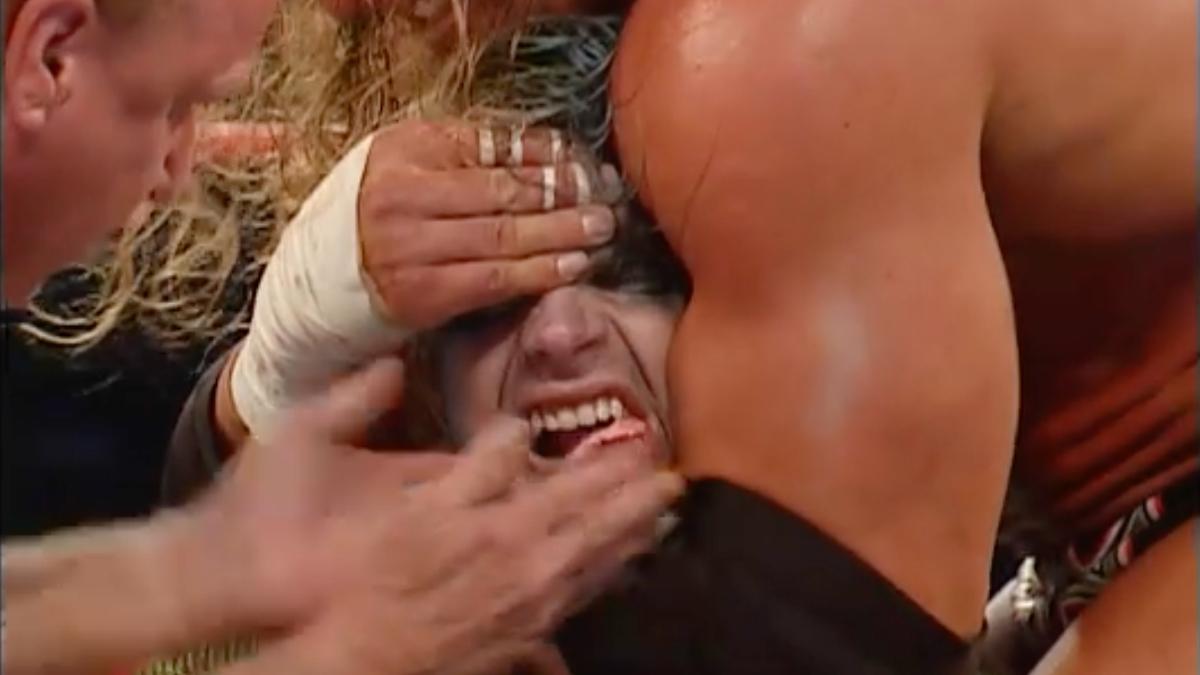 Triple H with a sleeper on Jeff Hardy, who is shouting in pain, on September 16, 2002 episode of WWE Raw