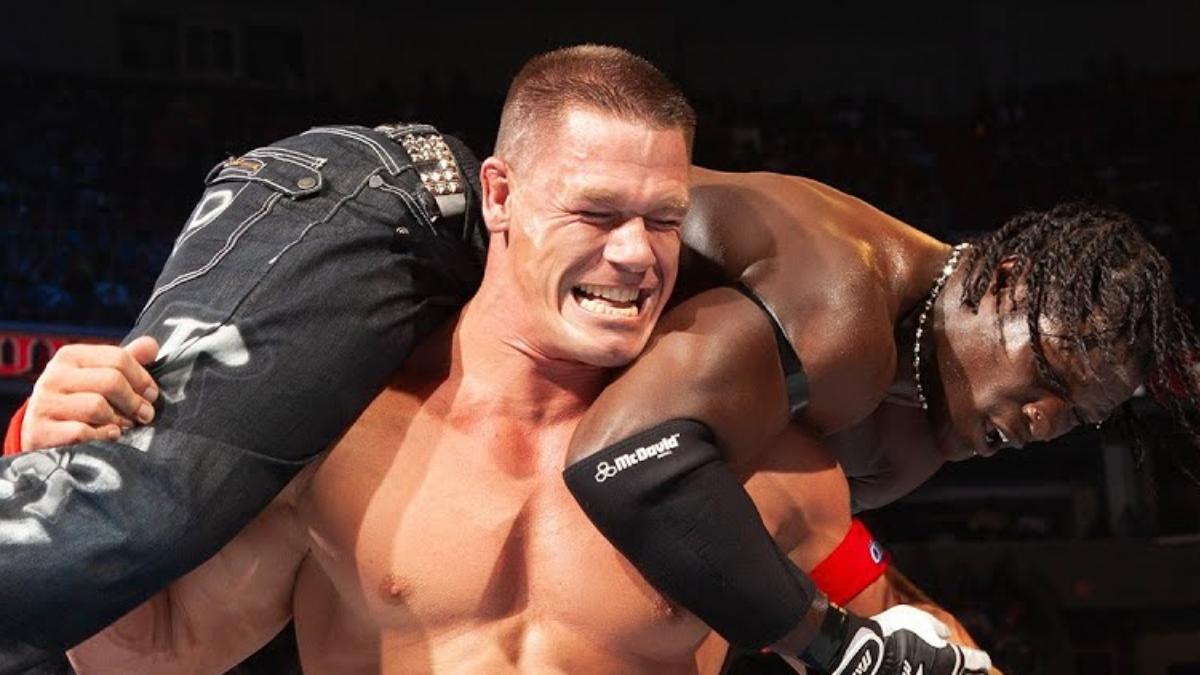 John Cena has R-Truth on his shoulders for the AA during their WWE Title match at Capitol Punishment 2011