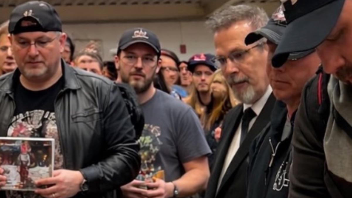 Close up of AI people at John Laurinaitis autograph signing