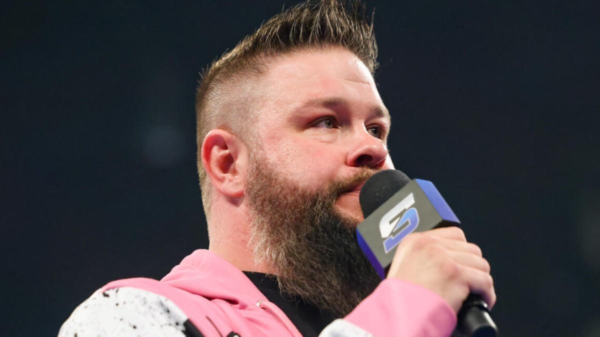 Kevin Owens with a microphone 