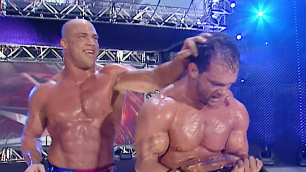 Kurt Angle ruffling Chris Benoit's hair at WWE No Mercy 2002
