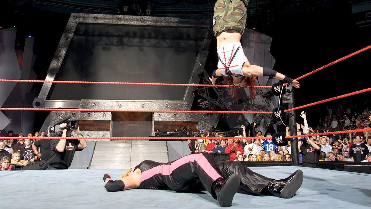 Lita hitting a Moonsault to Trish Stratus in December 2004 during the main event of WWE Raw