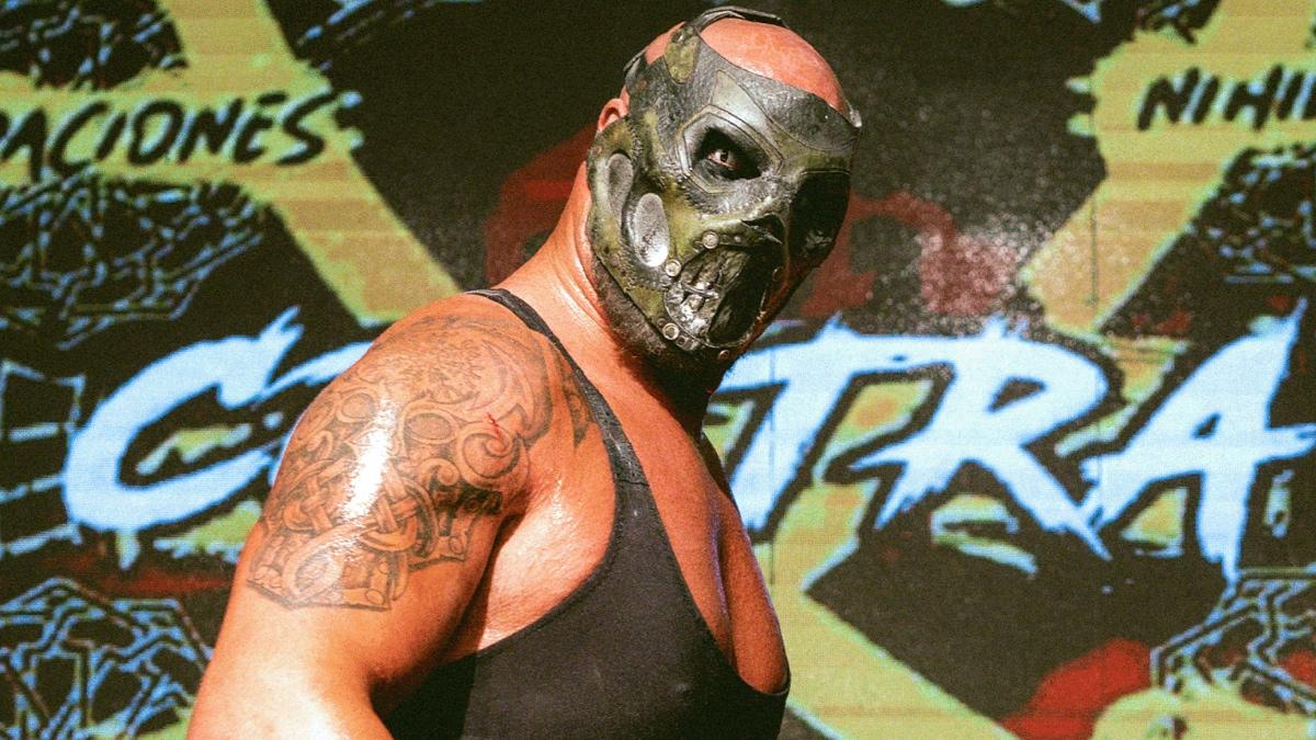 Mads Krule Krugger wearing a skull mask looking down