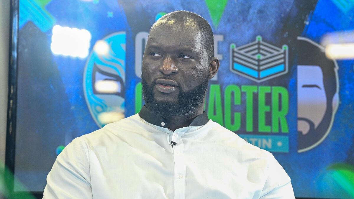 A close-up shot of WWE star Omos from a WrestleMania Axxess event in 2022