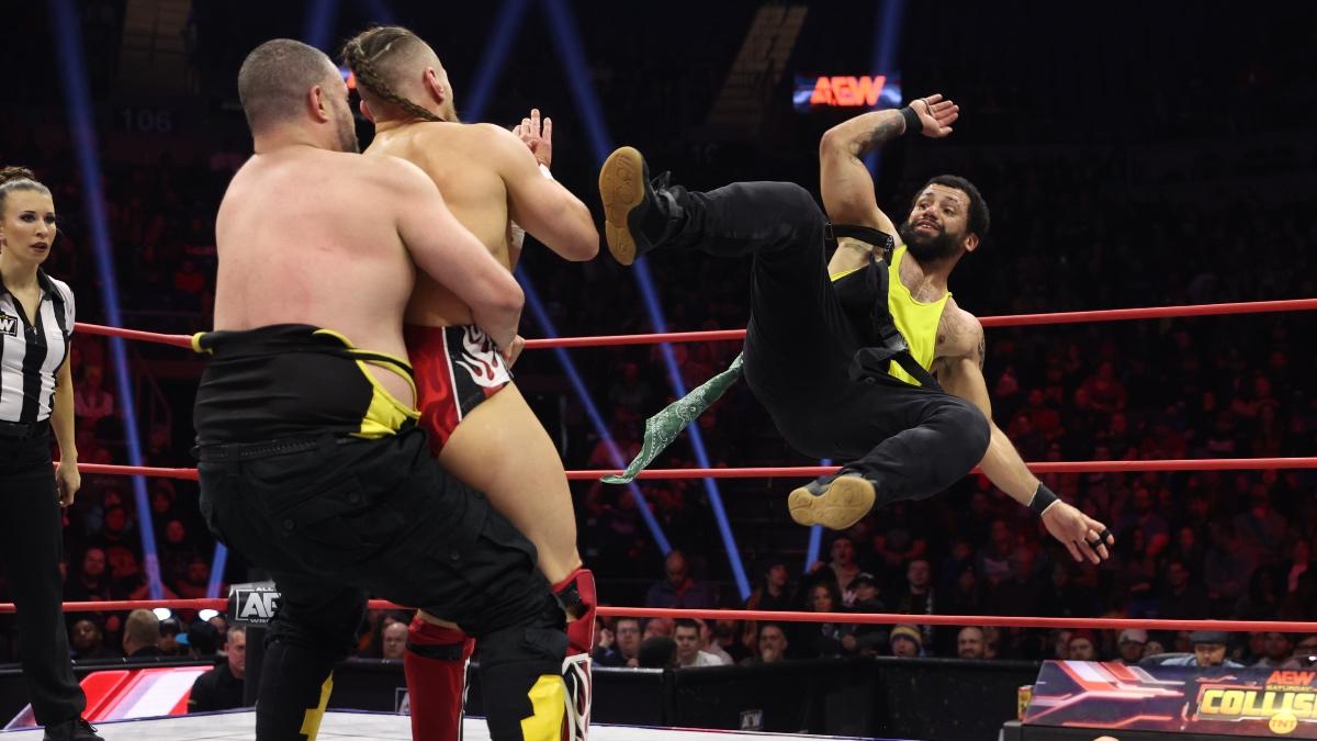 Ortiz hitting a dropkick to Bryan Danielson while Eddie Kingston holds him