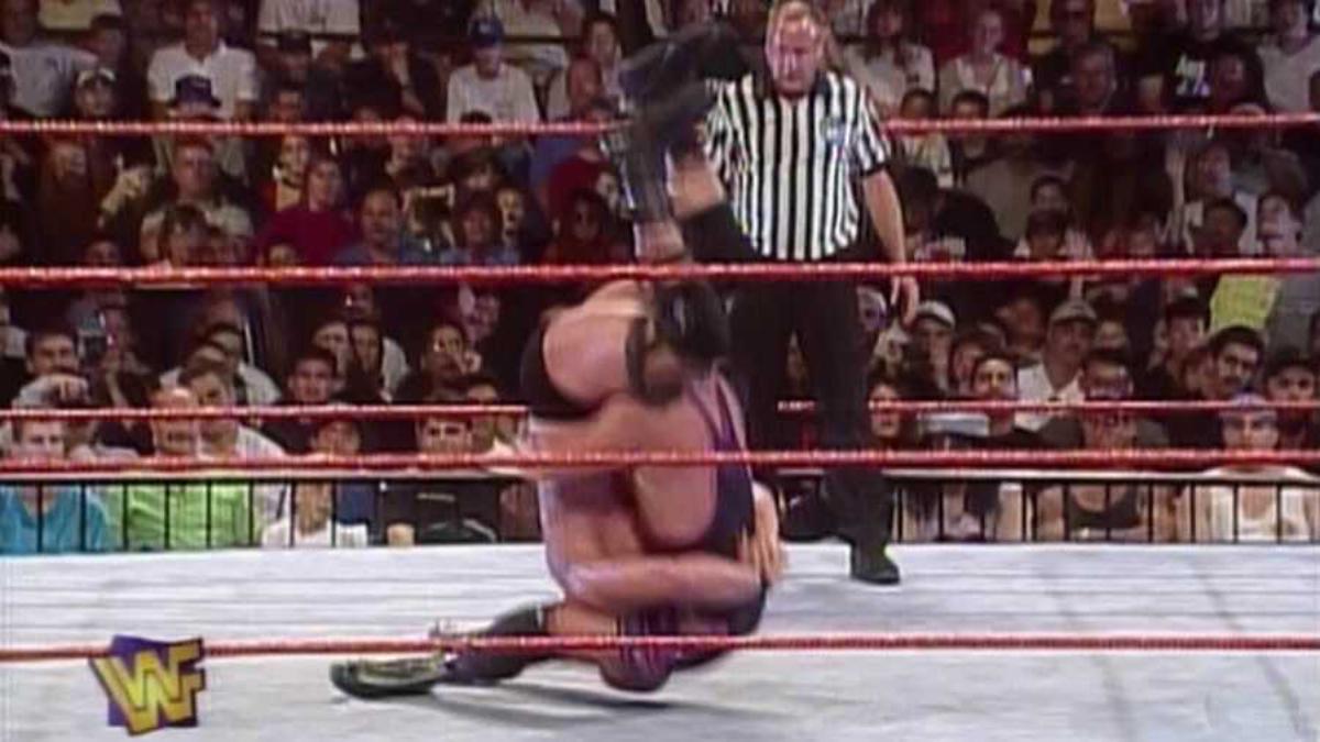 Owen Hart hitting a sit-out piledriver to Steve Austin at WWE SummerSlam 1996