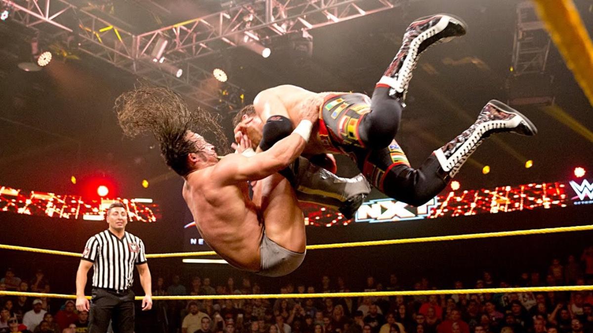PAC sitting a codebreaker on Sami Zayn on WWE NXT